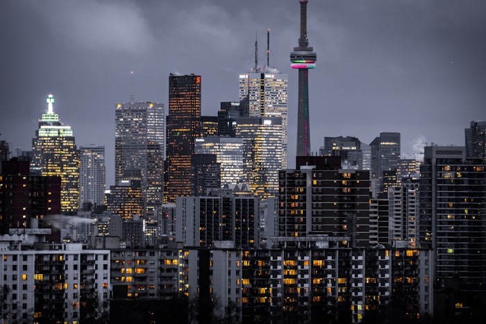 Urban multifamily buildings at dusk — investment consulting